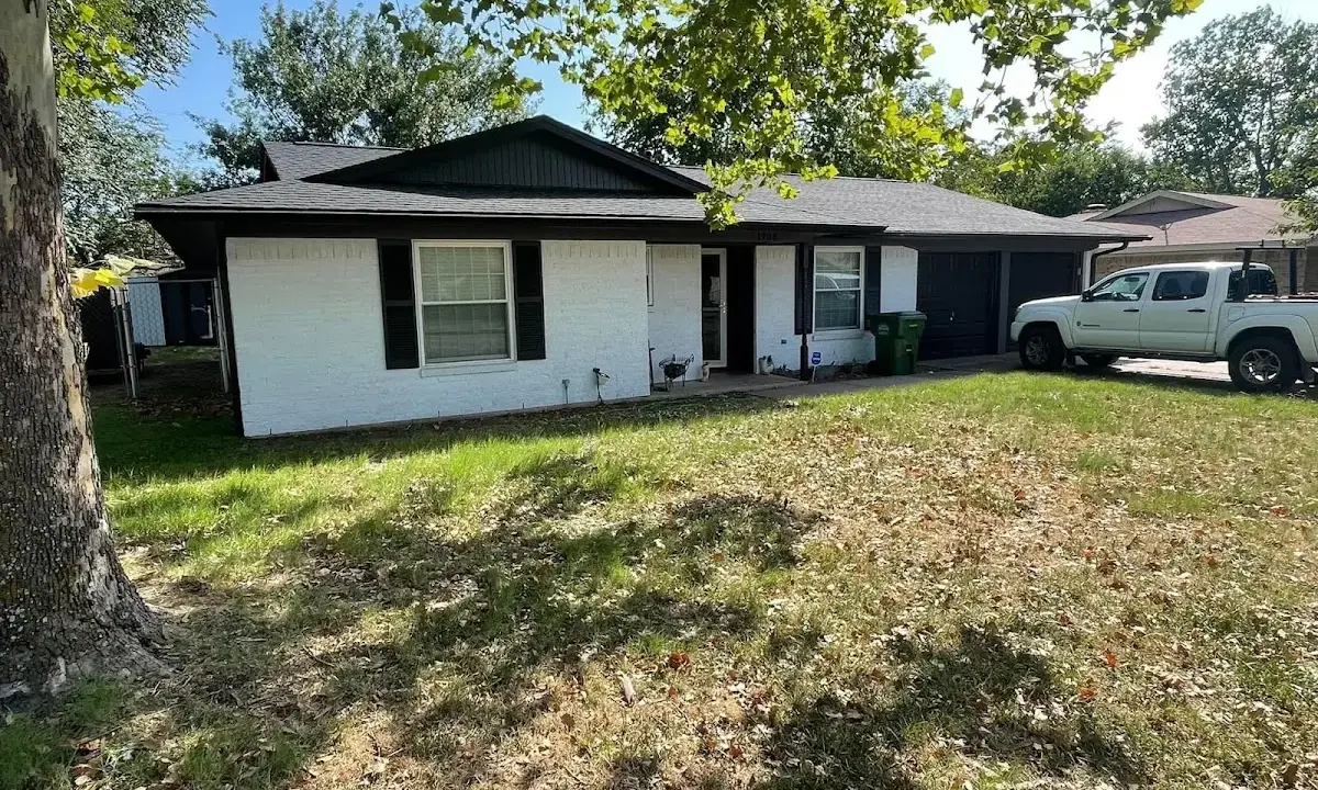 Professional roofing crew working on a residential roof in Palmview